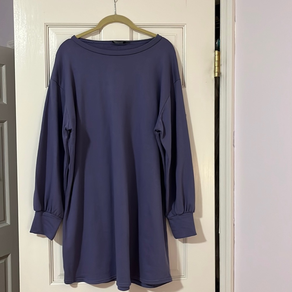 Never worn , cotton dress  is above the  knee, sleeves have a little puff to it.